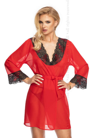 A person with long blonde hair models the Irall Erotic Oriana Gown Red, a sheer red robe adorned with black lace detailing at the neckline and cuffs. This delicate chiffon dressing gown by Irall Erotic is elegantly tied with a matching red sash at the waist. The person poses confidently with one hand on their hip and the other resting beside them.