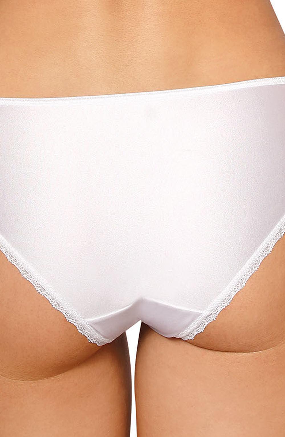 A close-up image of a person wearing the Roza Anuk Brief White panties. The focus is on the lower back and upper thigh areas, accentuating the smooth fabric and subtle embroidered lace trim by Roza, which adds an elegant and luxurious touch to these seamless undergarments.