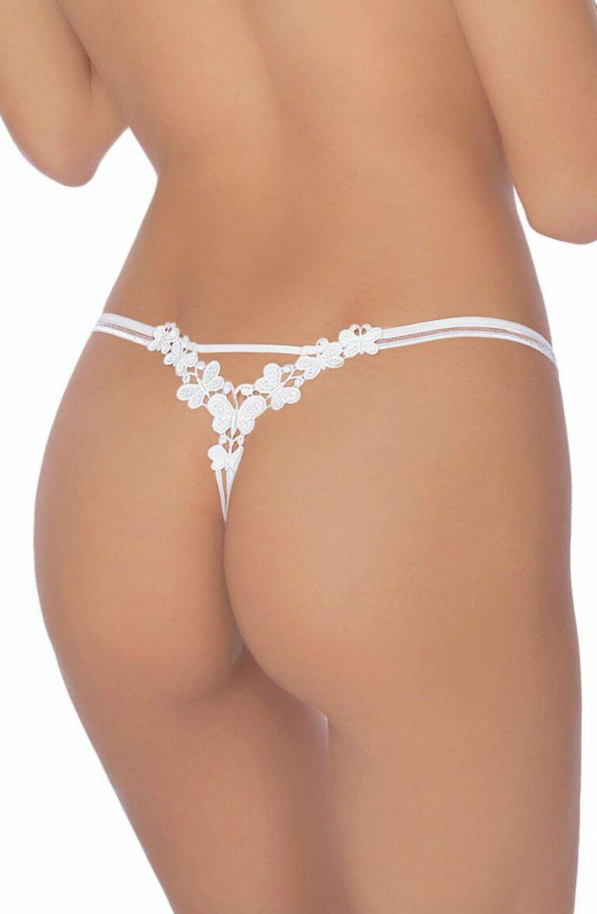 A close-up image of a person from the back showcases the delicate lace of the Roza Fiona Thong White with its elegant floral designs. The thin straps and detailed embroidery are highlighted against smooth skin, emphasizing the intricate back detail of this exquisite lingerie piece by Roza.