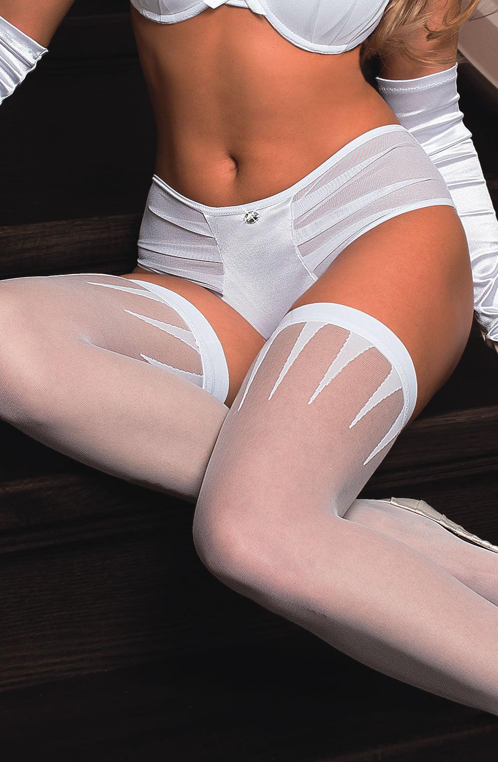 A person wearing white lingerie from the Roza Frosa Thong White collection, including a bra, high-waisted panties adorned with a center jewel, white stockings featuring unique sheer detailing, and gloves. The image highlights the midsection and thighs, showcasing the intricate design and satin-style fabric of the Roza lingerie.