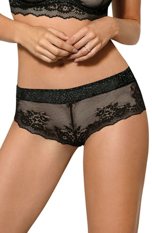 A woman is wearing the Roza Kena Black Brief, a lacy lingerie set by Roza that includes seductive thongs. The design boasts intricate floral lace patterns and sheer fabric elements. She has a ring on her left hand. The image focuses on her torso and midsection, emphasizing the exquisite details of the lingerie.