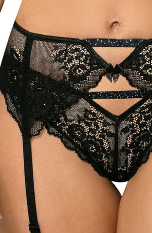 Close-up of a woman wearing black lace lingerie showcasing intricate floral lace designs. The elegant and seductive ensemble, from the Roza Kena collection by Roza, features a thong with decorative cutouts and a garter belt with straps. The background is plain white.