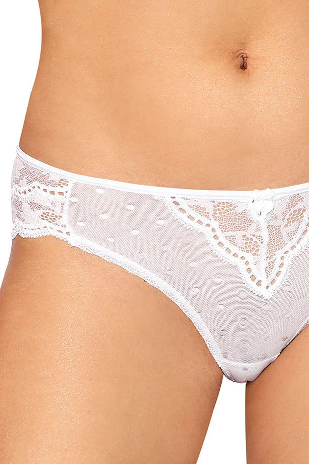 Close-up of a person wearing Roza Lagerta Brief White by Roza, featuring white lace panties with a delicate polka dot pattern and small bow detail at the front. The sheer mesh fabric showcases intricate floral lace designs on both sides, providing a feminine and elegant look.