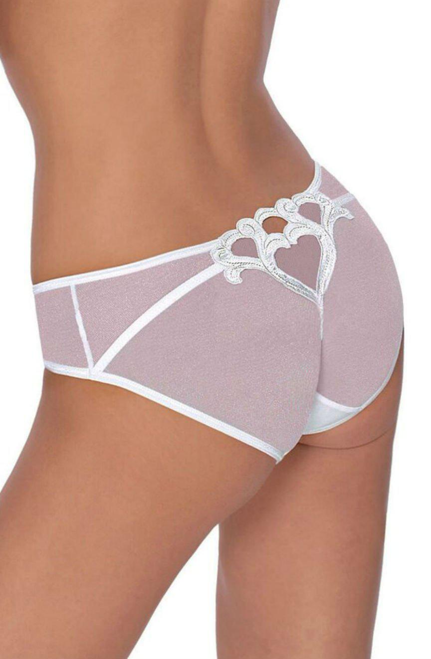 A person wearing Roza Lica Brief White panties in mauve lace with white accents. These sheer mesh panties feature a heart-shaped cutout adorned with floral embroidery on the back. The image focuses on the lower back and hips, with the person turned slightly to the side.