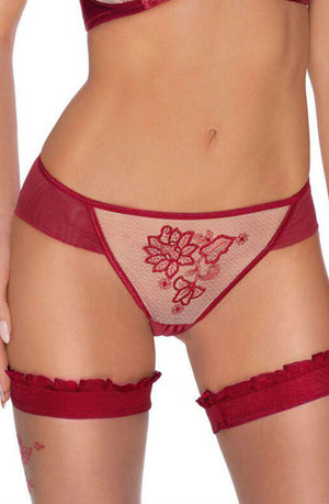 A person wearing the luxurious Roza Mehendi Brief Claret lingerie set featuring elegant floral embroidery. The matching lace panties and garters complement the intricate design on the midsection, which exudes elegance reminiscent of Mehendi designs. The background is not visible.