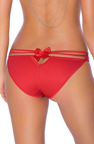 A woman is seen from the back wearing the Roza Mimi Brief in bright red, featuring a small bow and keyhole cutout at the waistband. She also wears delicate, draping body jewelry across her back, enhancing the elegant appeal of this luxurious Roza brief.