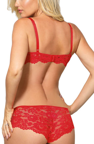 A woman with blonde hair is shown from the back, wearing a matching red lace lingerie set. She dons the Roza Newia Red Push Up Bra with adjustable straps and a pair of lace boyshorts, adorned with satin ribbon bows. This elegant ensemble is part of our Lacey Collection by Roza, featuring intricate lace patterns throughout.