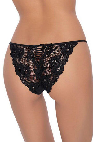 A person is wearing Roza's Roza Sarina Black lace underwear, featuring a crisscross design on the back. The image focuses on the person's lower back and buttocks, showcasing the intricate detailing of this delicate lace lingerie. The background is plain and unobtrusive.