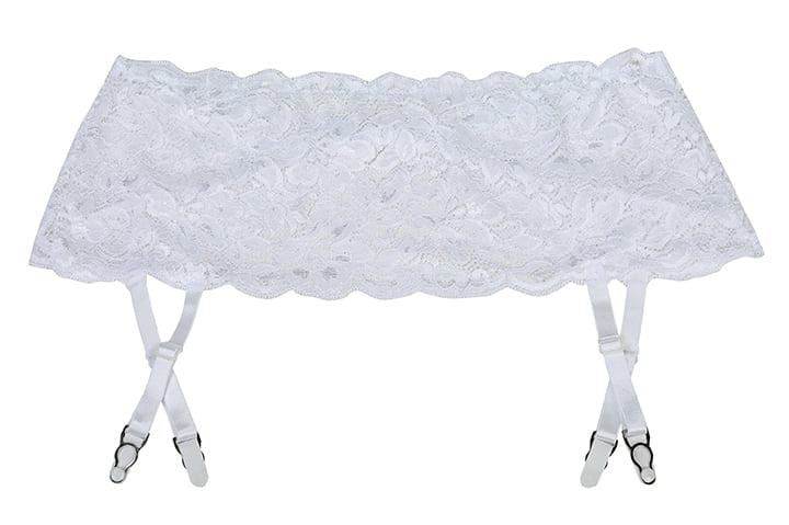 Introducing the Shirley Of Hollywood 20146 Suspender Belt White by Shirley of Hollywood. This exquisite stretch lace garter belt boasts intricate floral patterns and features four adjustable suspender straps with metal clips, ideal for attaching to stockings. The design exudes delicacy and elegance, available in one size for a perfect fit.