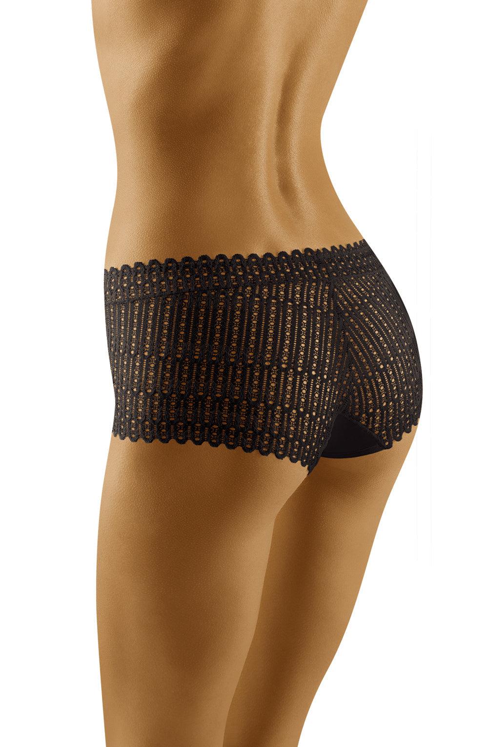 A person is wearing the Wolbar Bari Black Brief, intricately patterned with a stunning design. The image focuses on the person's lower back and upper thighs, showcasing the detailed craftsmanship of the striking fabric. The white background creates a contrast that highlights this elegant garment from Wolbar.