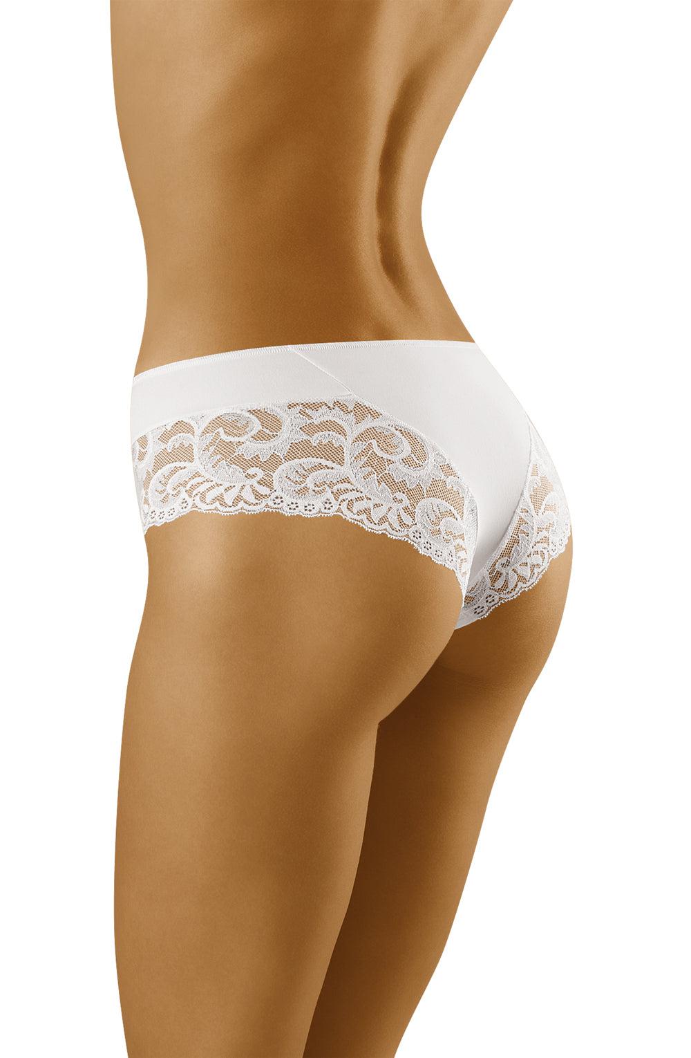 A person wearing the Wolbar Cara White Briefs is shown from the side and back, highlighting the intricate lace detailing and snug fit of this luxury lingerie by Wolbar. The tan skin tone accentuates the contours and shape of the lower torso and upper thighs.