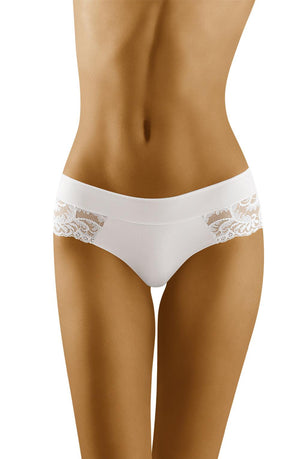 A person modeling the Wolbar Cara White Briefs with intricate lace detail. The image focuses on their midsection, highlighting the detailed lace design on the sides of these luxury Wolbar lingerie panties. The background is plain, keeping the emphasis on the exquisite lingerie.