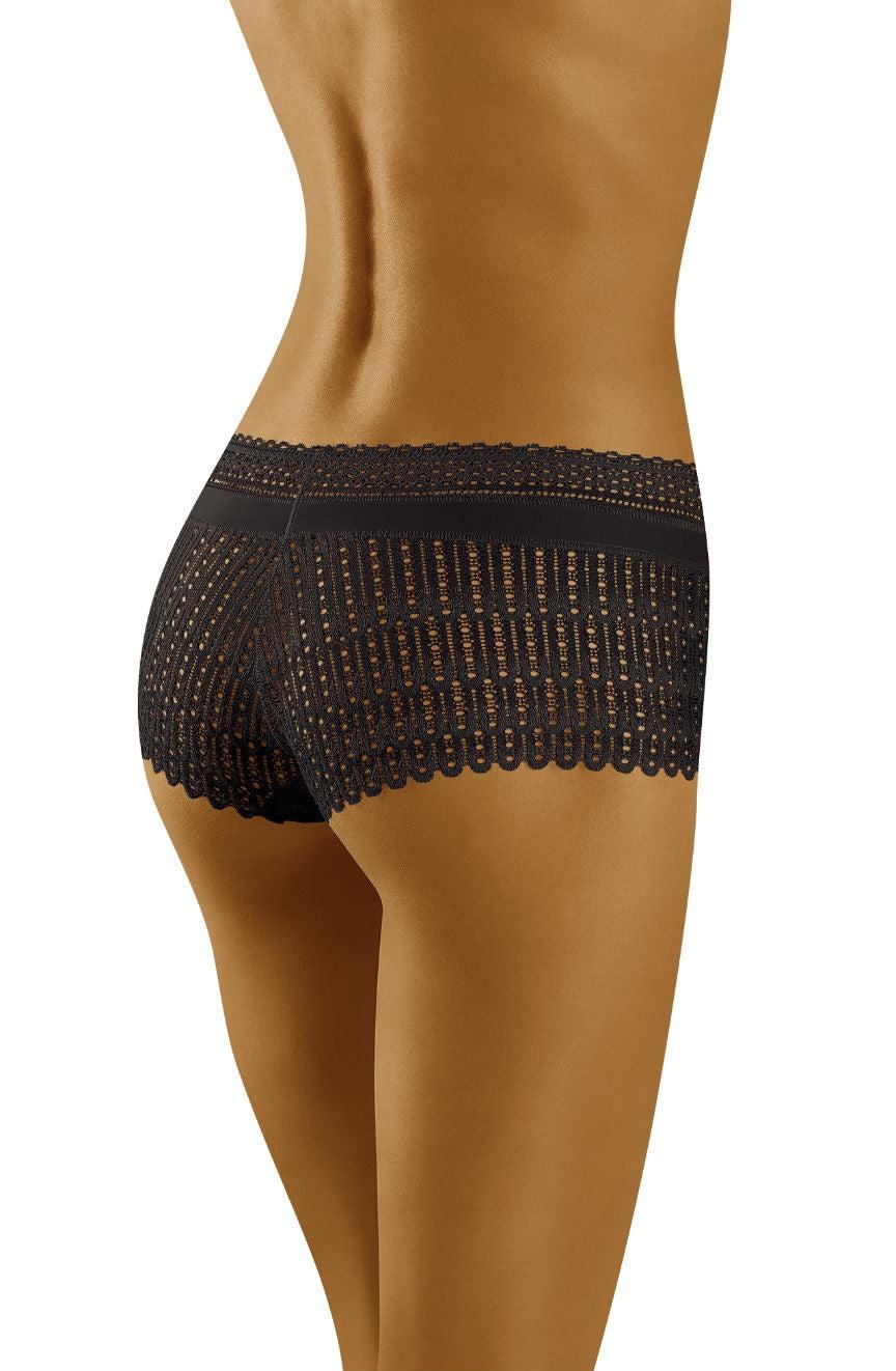 A person with a tanned complexion is shown wearing Wolbar Riki Black Shorts from the mid-back down to the upper thighs. The intricate lace details of the shorts feature a scalloped edge along the waistband and leg openings. The person poses with a slight profile view, highlighting the allure of these seductive shorts by Wolbar.