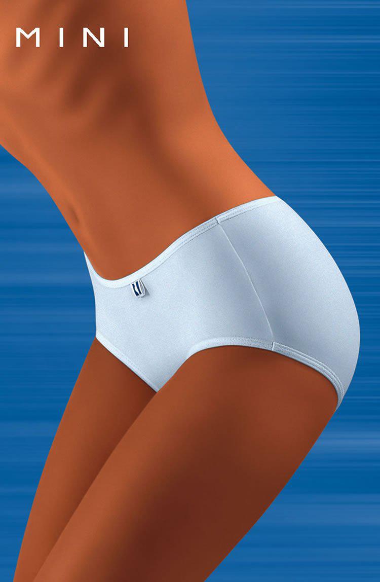 A person wearing comfortable Wolbar Tahoo Mini White Briefs against a blue background. The word "MINI" is written in white at the top left corner. The image highlights the lower torso and upper thighs, emphasizing the fit and style of the underwear from Wolbar.